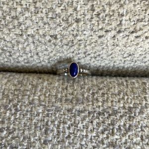 Retired James Avery Ring with a beautiful purple oval lapis stone in the center.